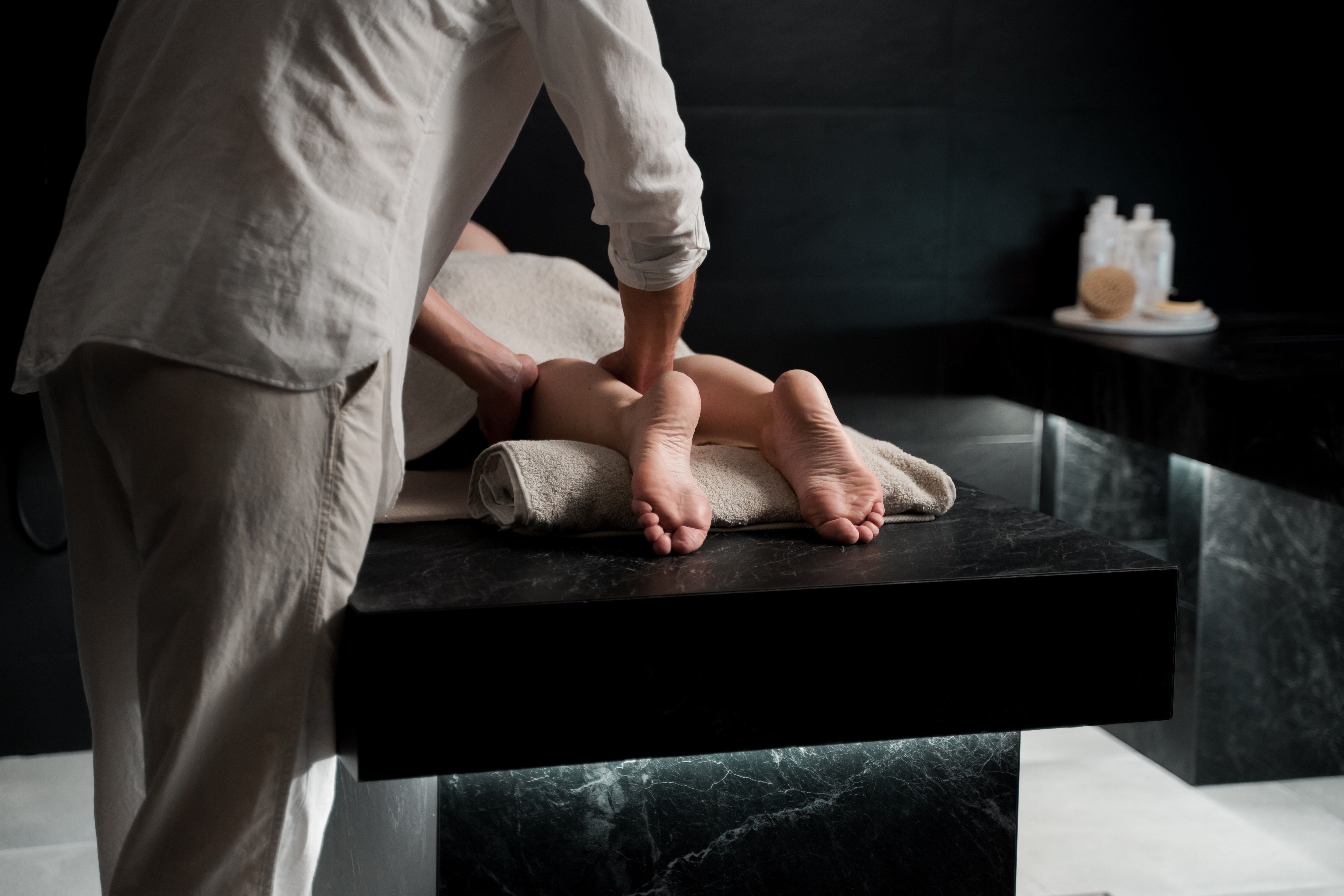 Couple sharing a relaxing massage at home with warm oil